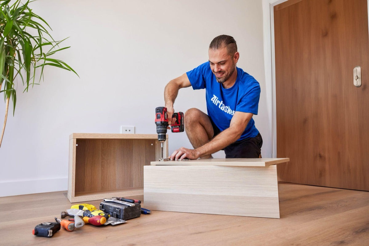 A Tasker assembling flat-pack furniture